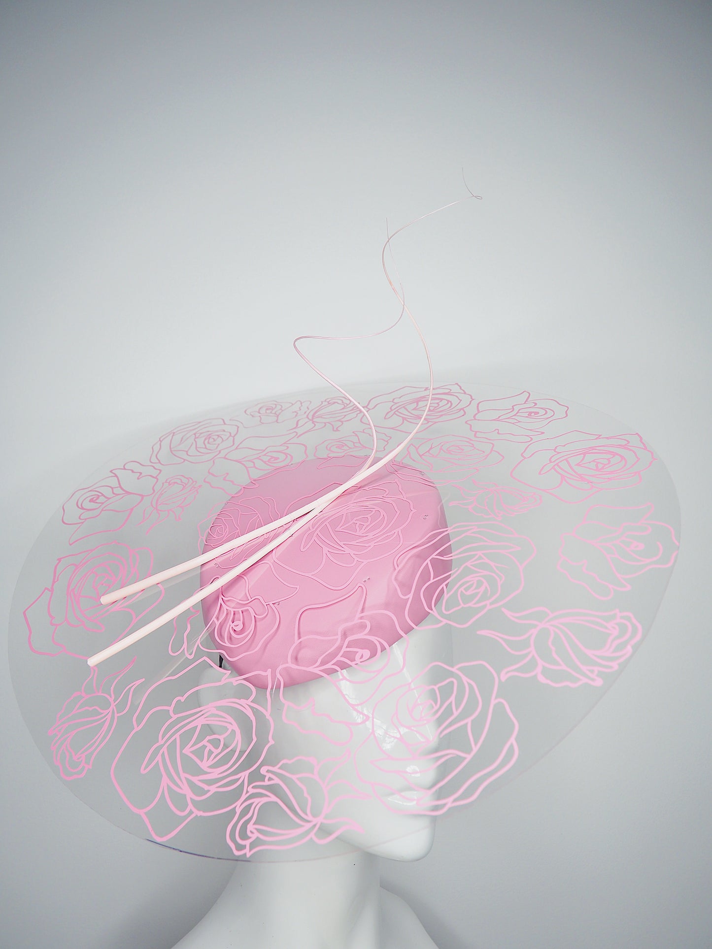 La Vie En Rose - Transparent Crystoform floral patterned brim on a pastel pink leather teardrop base.