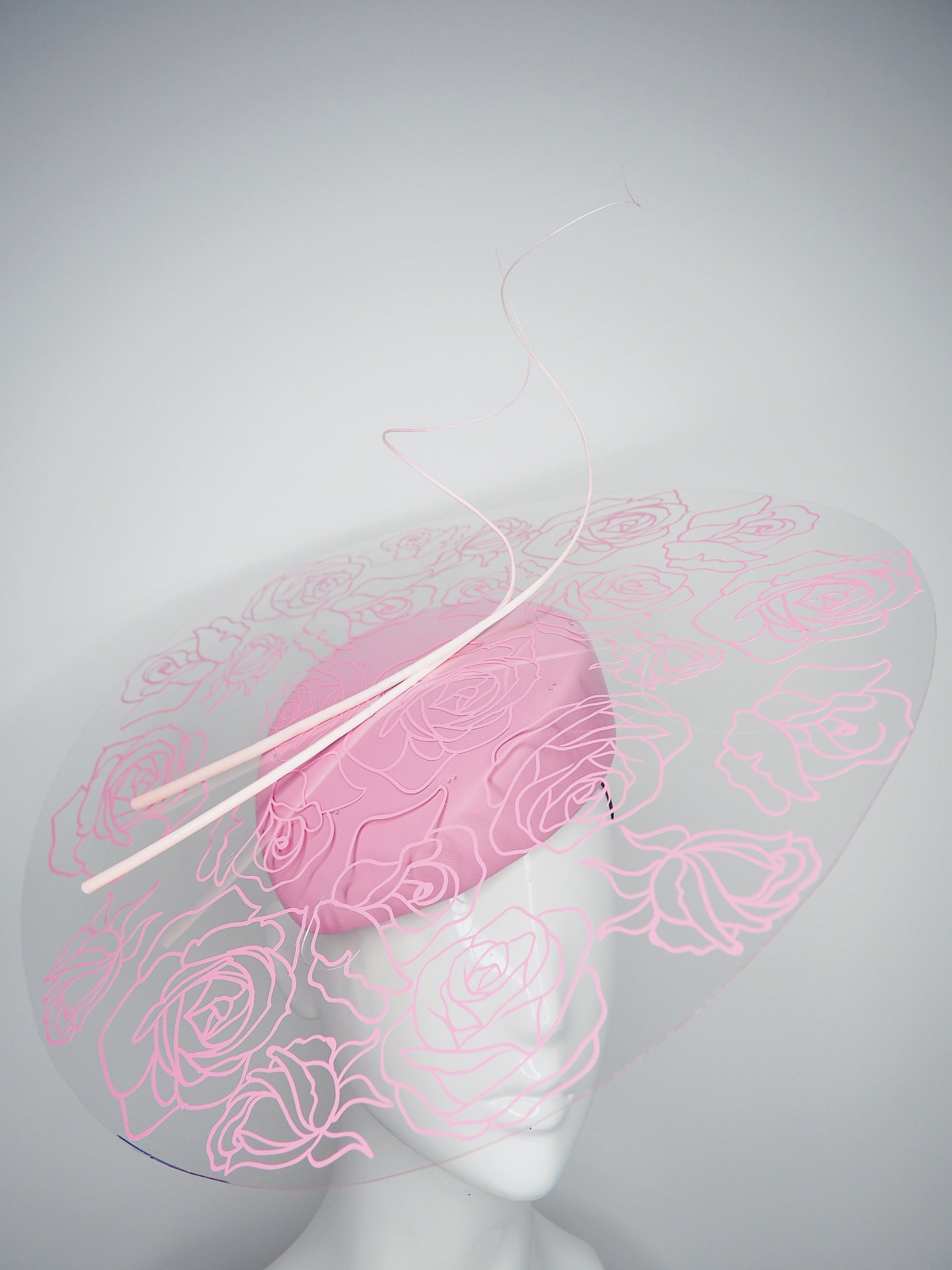 La Vie En Rose - Transparent Crystoform floral patterned brim on a pastel pink leather teardrop base.