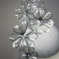 celestial Cosmos - Silver round percher with crystoform silver and clear Cosmo flowers