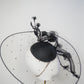 A Rainy Day in Melbourne - Black clear cristoform brim with wispy crinline roses  & crinoline swirl