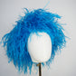 Azure Plume - pillbox covered in luxurious turquoise feathers for modern elegance with vintage glamour.