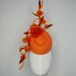 Clementine Twist - Orange pork pie pillbox with crystoform rose vine and tubular crinoline swirl