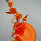 Clementine Twist - Orange pork pie pillbox with crystoform rose vine and tubular crinoline swirl