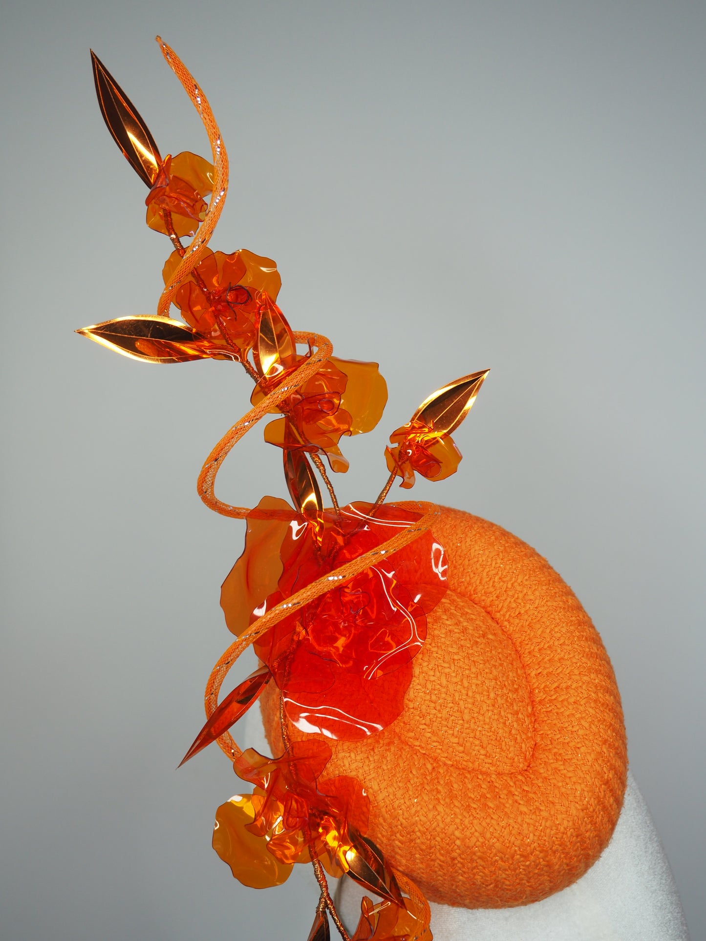 Clementine Twist - Orange pork pie pillbox with crystoform rose vine and tubular crinoline swirl