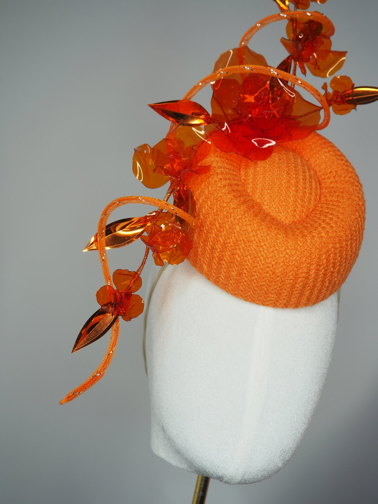 Clementine Twist - Orange pork pie pillbox with crystoform rose vine and tubular crinoline swirl