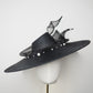 Pearl Noir - Black parasisal asymmetric crown slanted brim hat with sculptural crinoline swirl and pearl accents