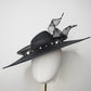 Pearl Noir - Black parasisal asymmetric crown slanted brim hat with sculptural crinoline swirl and pearl accents