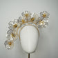Golden Aura - Gold Crystoform flower headpiece with intricately detailed gold-edged petals on a floating wired frame