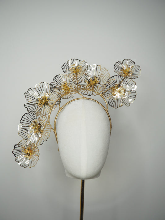 Golden Aura - Gold Crystoform flower headpiece with intricately detailed gold-edged petals on a floating wired frame