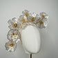 Golden Aura - Gold Crystoform flower headpiece with intricately detailed gold-edged petals on a floating wired frame