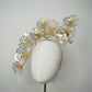 Golden Aura - Gold Crystoform flower headpiece with intricately detailed gold-edged petals on a floating wired frame