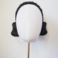 Midnight Elegance - Black vintage straw rear-facing Jackie O style pillbox with Parisissal bow