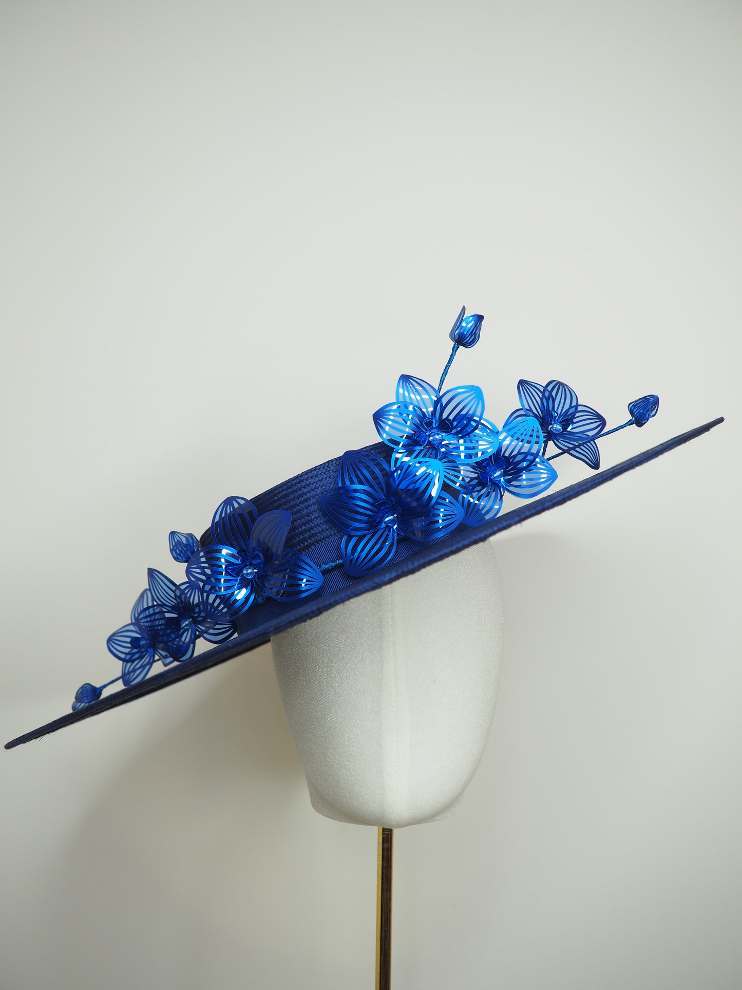 Deep blue - Deep blue straw boater with orchid vine in shades of blue crystoform.