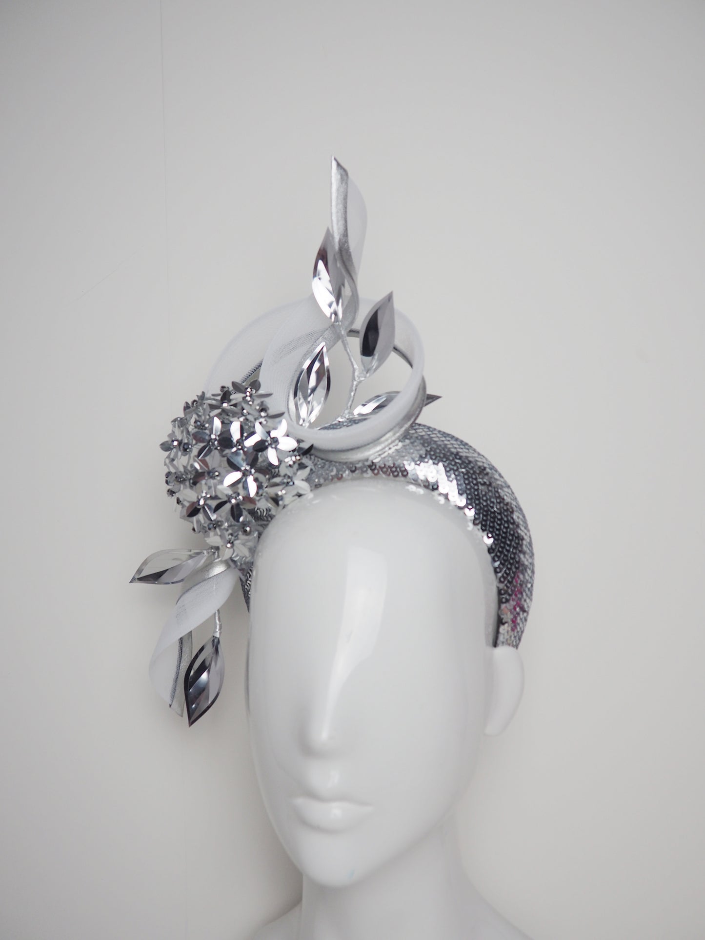 Disco Swirl -silver sequined 3d Headband with a Green Allium flower and crinoline swirl