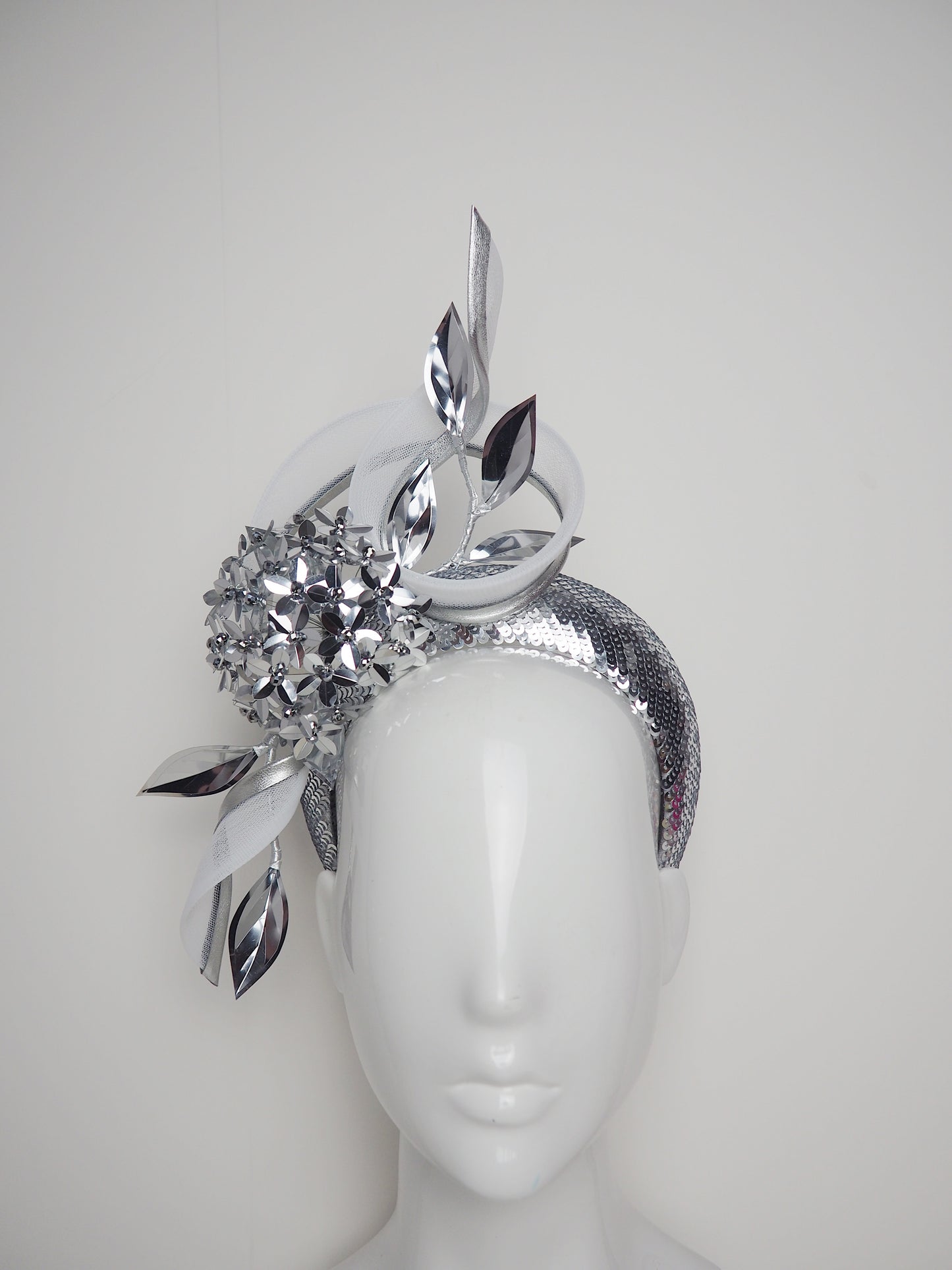 Disco Swirl -silver sequined 3d Headband with a Green Allium flower and crinoline swirl