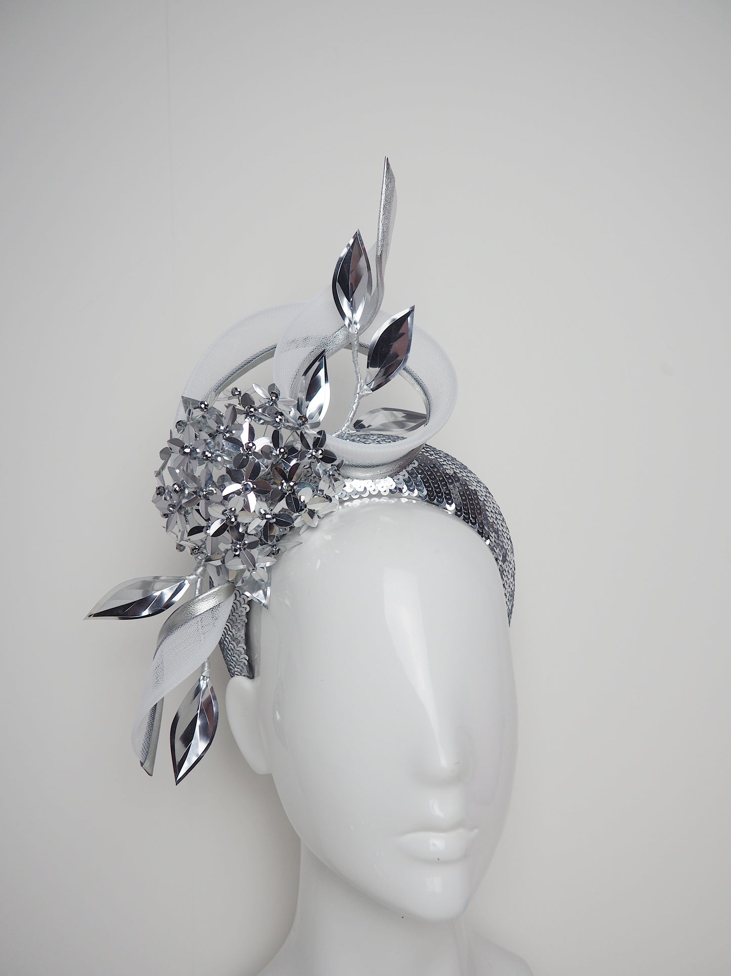 Disco Swirl -silver sequined 3d Headband with a Green Allium flower and crinoline swirl