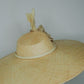 Nature in Bloom-Natural straw asymmetric brim hat with hand-sculpted rose and swirls