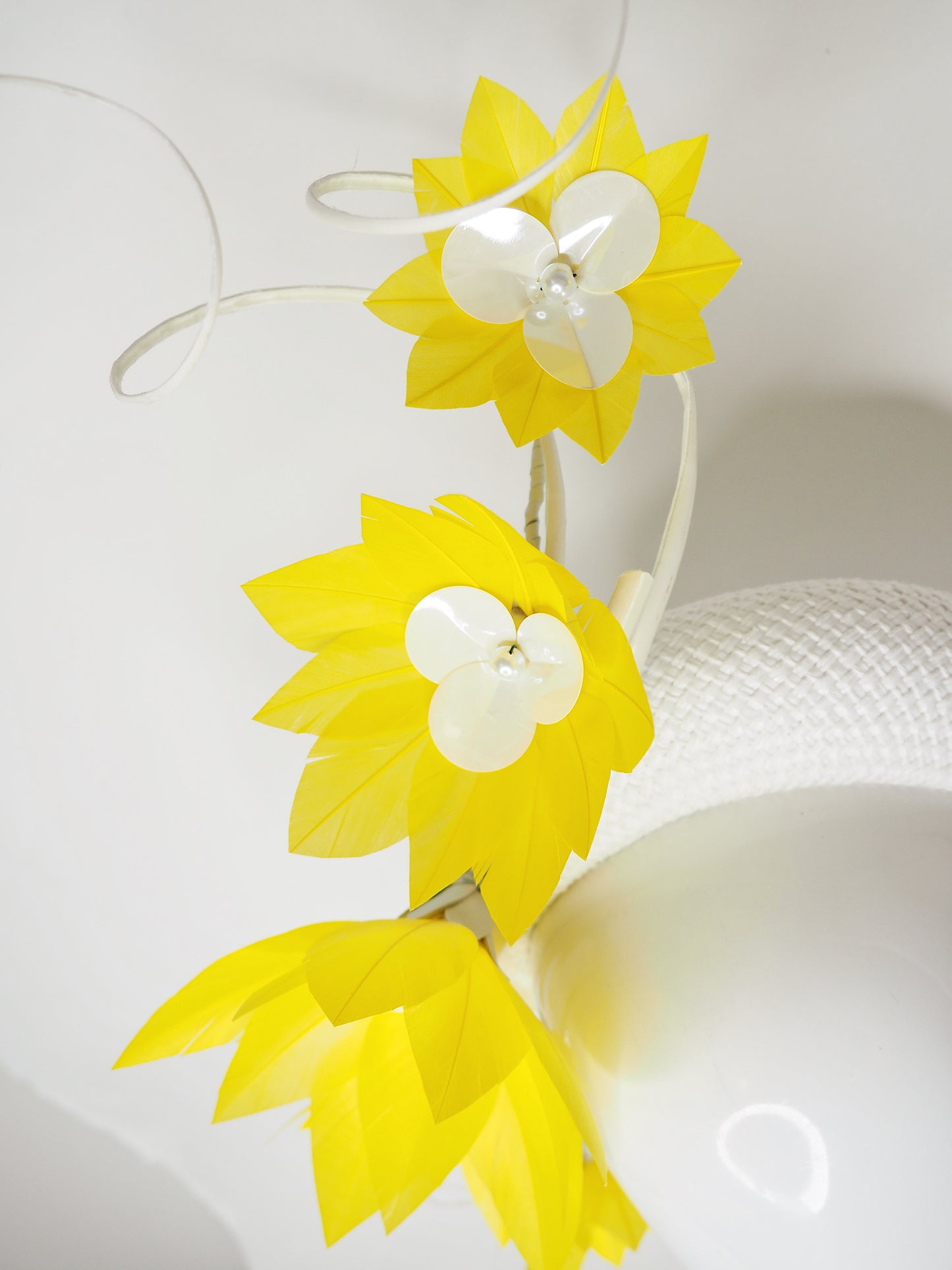 Pre-loved - You Are My Sunshine -Yellow Feather flower vine with ostrich quills on a white woven 3d headband