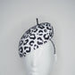 Lets Go Girls - Black Leather Leopard print cutouts on a white leather beret base