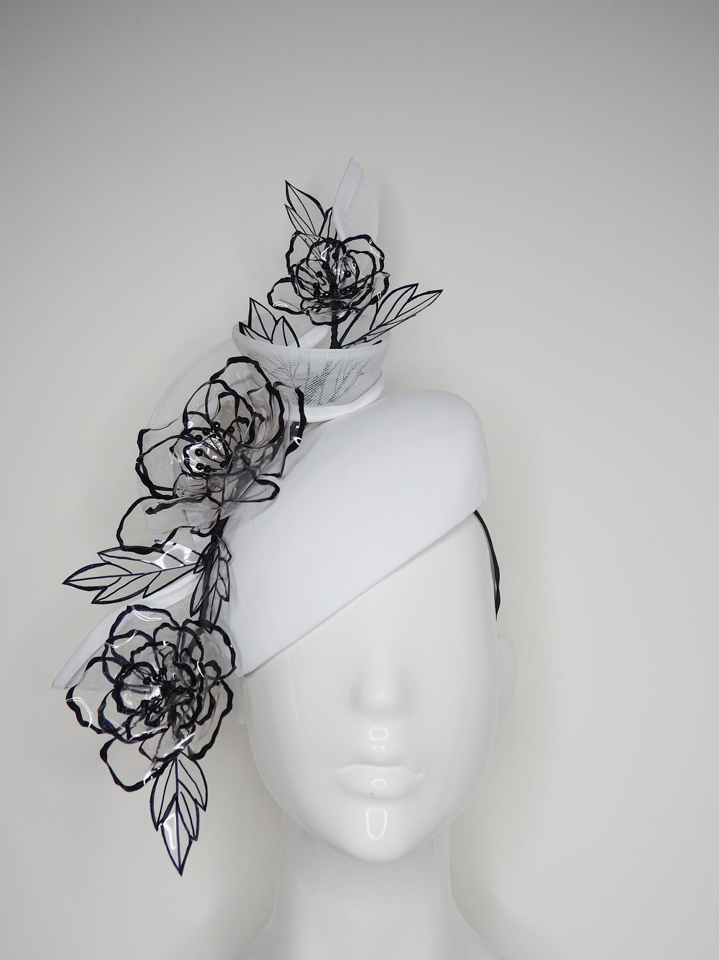 Translucent illusion - white leather face-hugger beret with crinoline swirl and flower detailing