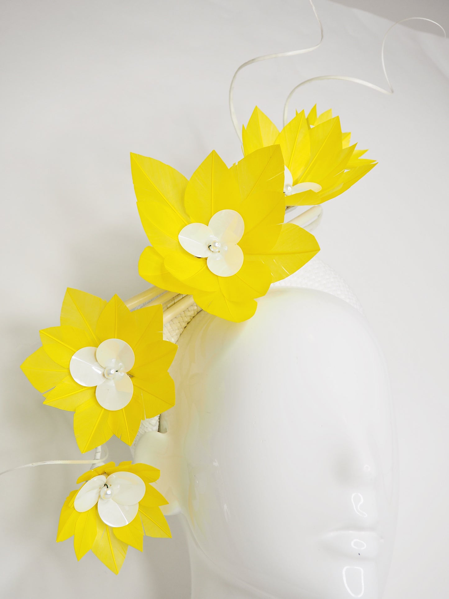 Pre-loved - You Are My Sunshine -Yellow Feather flower vine with ostrich quills on a white woven 3d headband