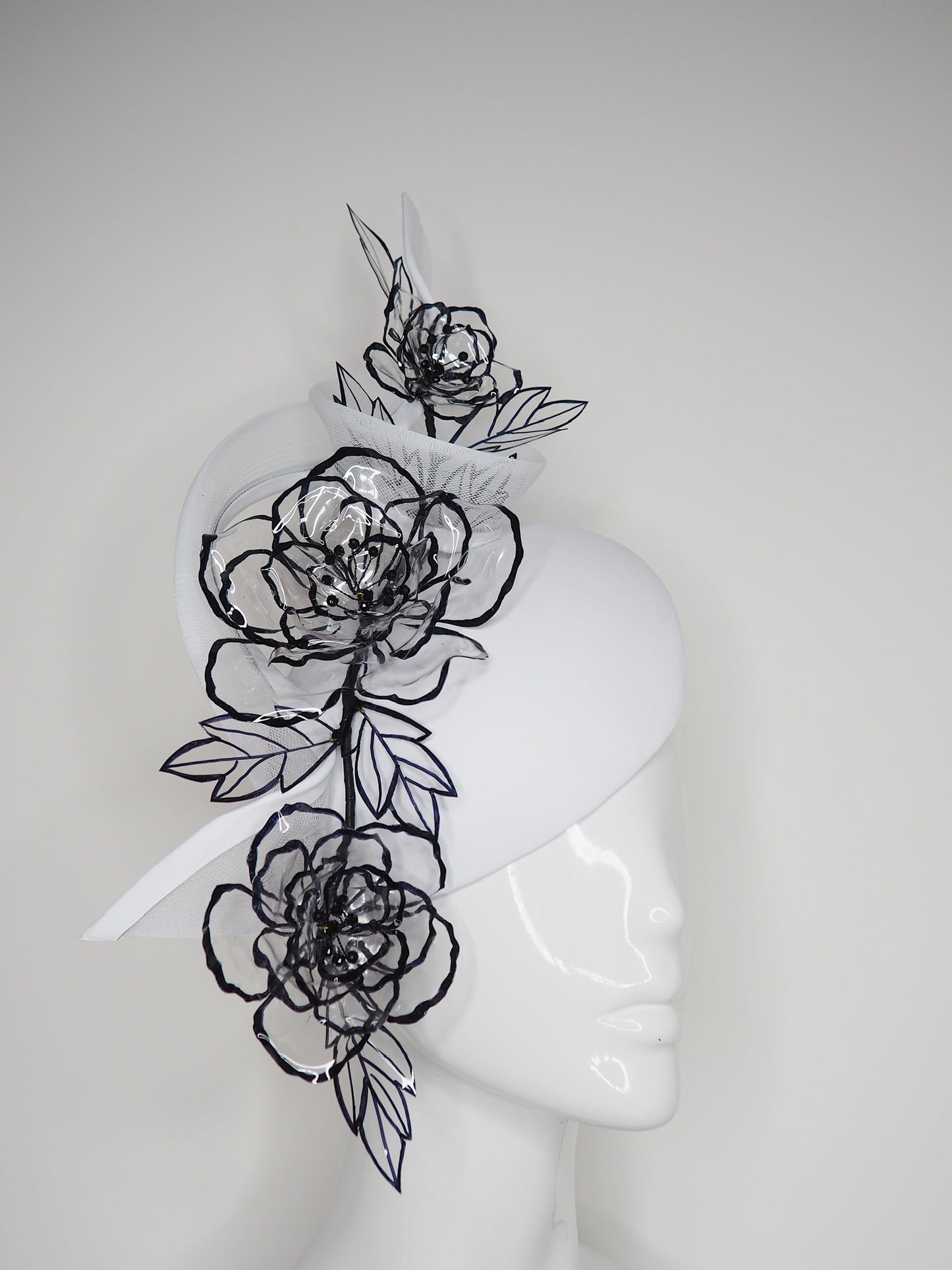 Translucent illusion - white leather face-hugger beret with crinoline swirl and flower detailing