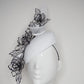 Translucent illusion - white leather face-hugger beret with crinoline swirl and flower detailing