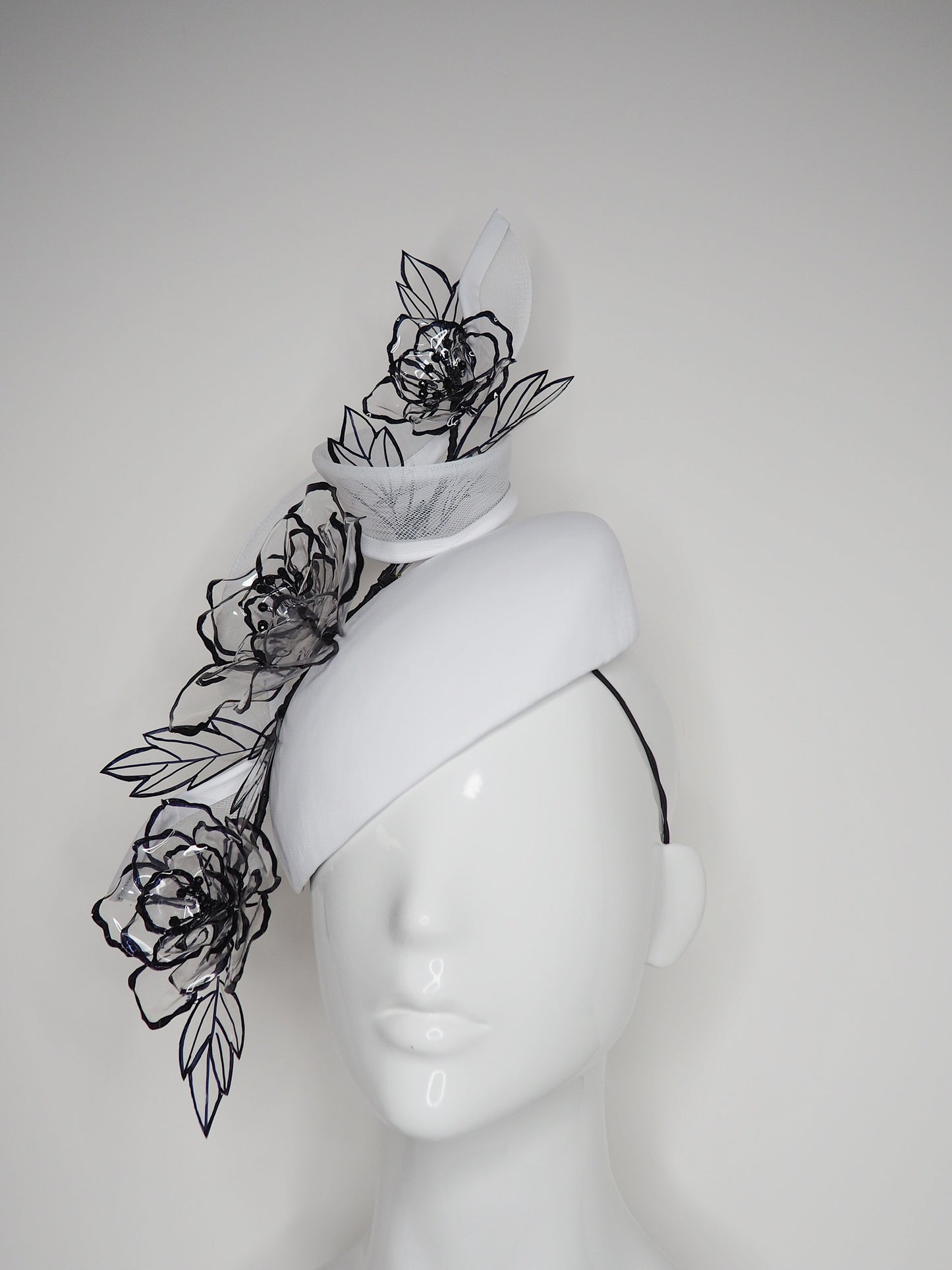 Translucent illusion - white leather face-hugger beret with crinoline swirl and flower detailing