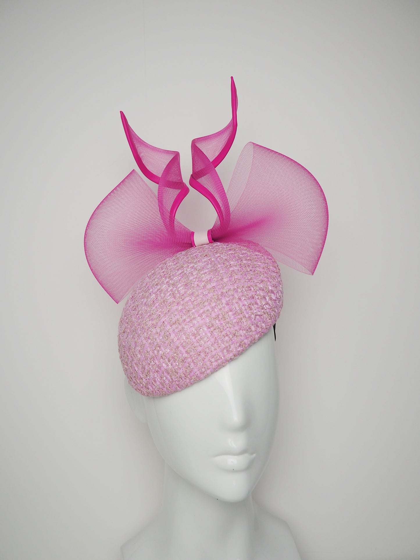 Bubblegum baby- Hot pink leather edged crinoline bow on a baby pink tweed face-hugger base.