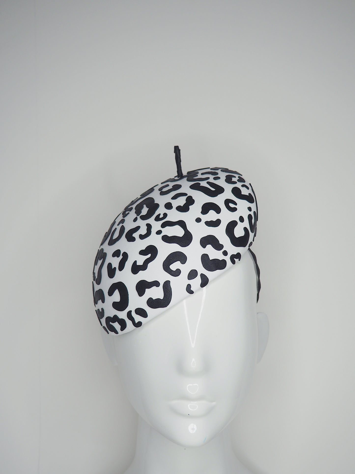 Lets Go Girls - Black Leather Leopard print cutouts on a white leather beret base