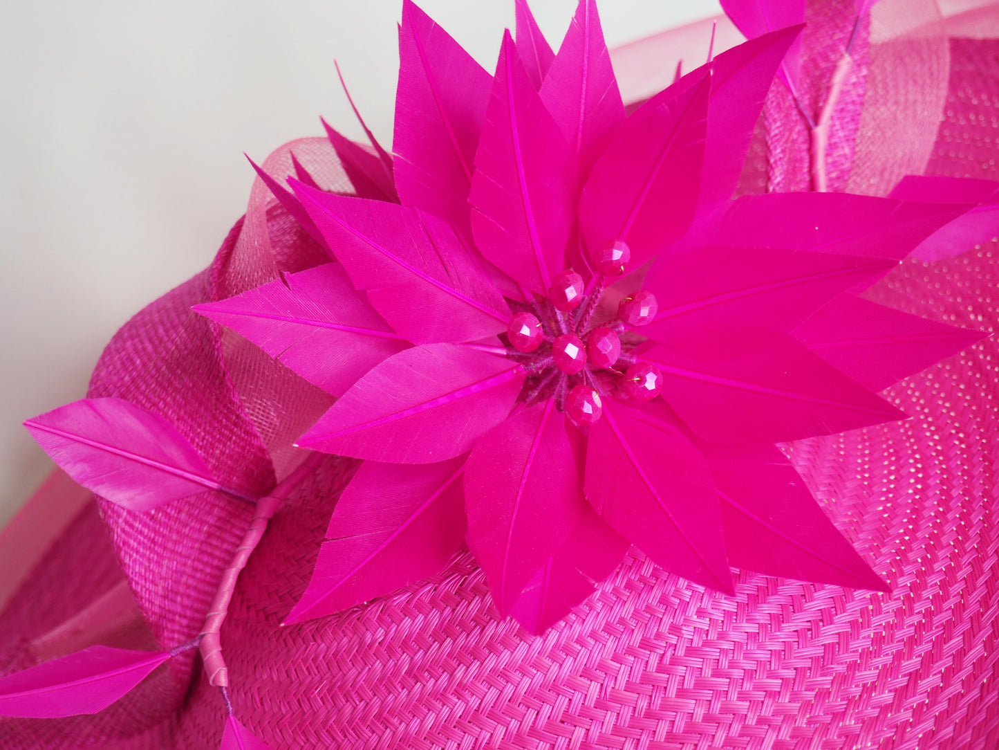 Big and Bright - Shocking pink buntal straw curved Saucer brim with Feather flower and crinoline edge