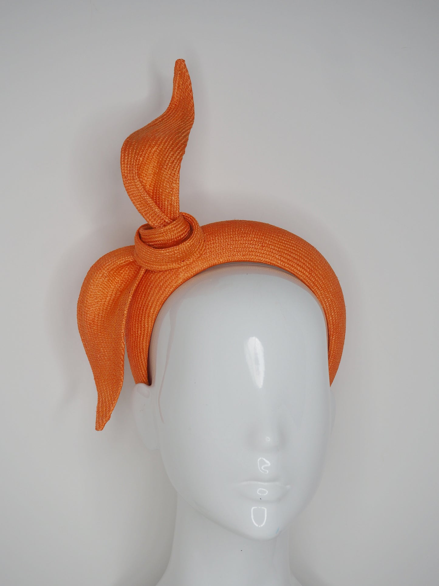 Tied in a Knot- Orange 3D blocked headband with a simple straw knot