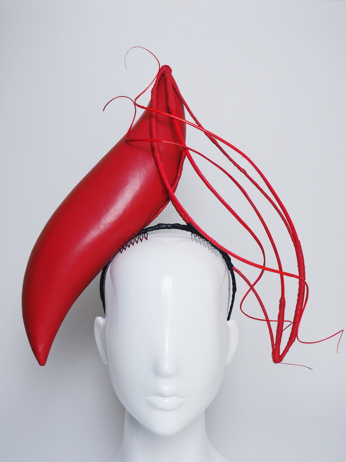 Wind and Fire- Leather S-shaped headband with ostrich Quill detial.