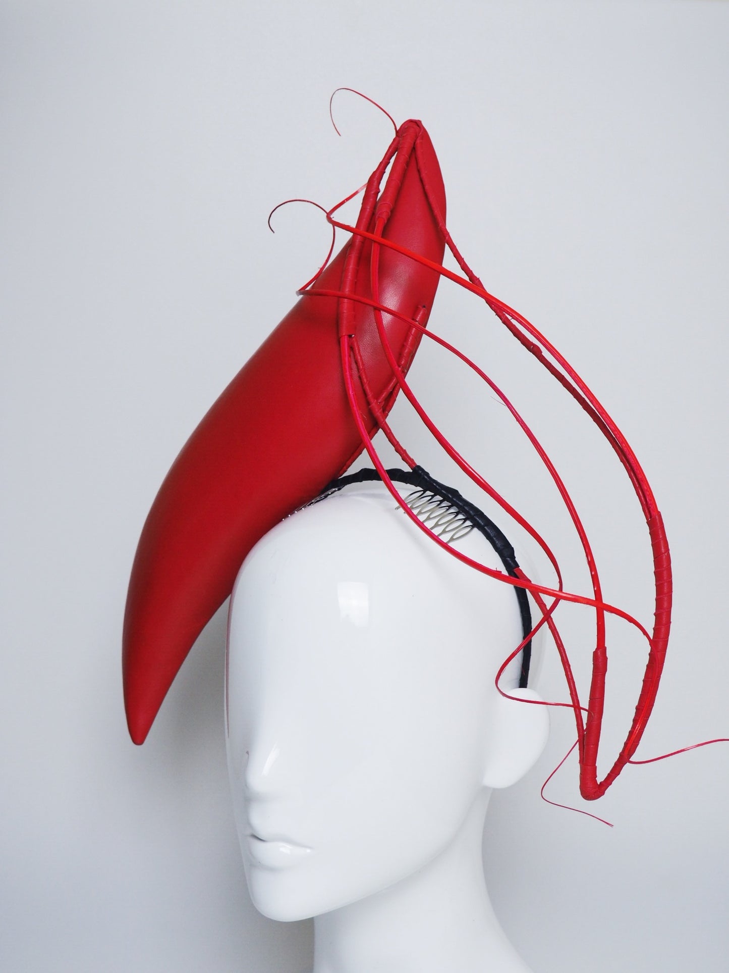 Wind and Fire- Leather S-shaped headband with ostrich Quill detial.