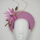 Sitting Pretty - Orchid pink tulle rear facing donut with feather flower, quills and veil detail.