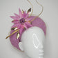 Sitting Pretty - Orchid pink tulle rear facing donut with feather flower, quills and veil detail.