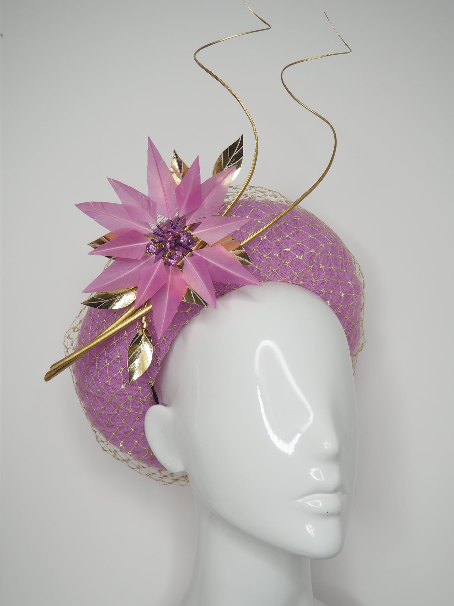 Sitting Pretty - Orchid pink tulle rear facing donut with feather flower, quills and veil detail.
