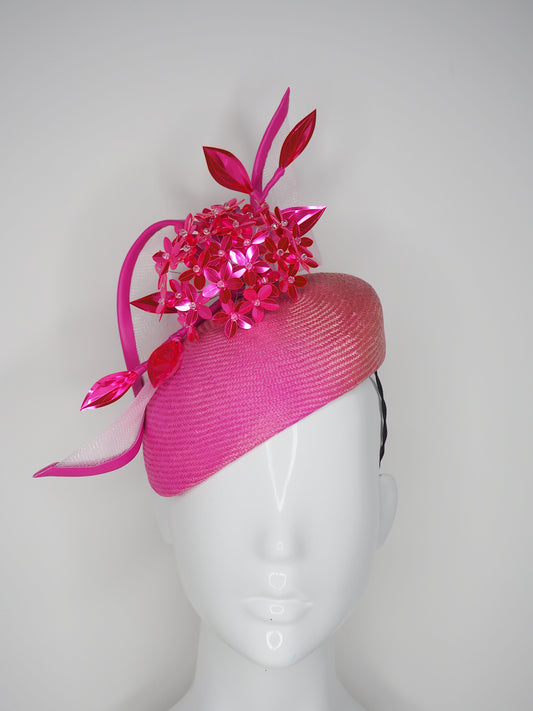 Disco barbie baby - hot pink Alium Flower ball on an ombre straw face hugger with a crinoline swirl headpiece.