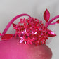 Disco barbie baby - hot pink Alium Flower ball on an ombre straw face hugger with a crinoline swirl headpiece.