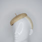 Knotty But Nice -  button beret on a Natural Straw headband.