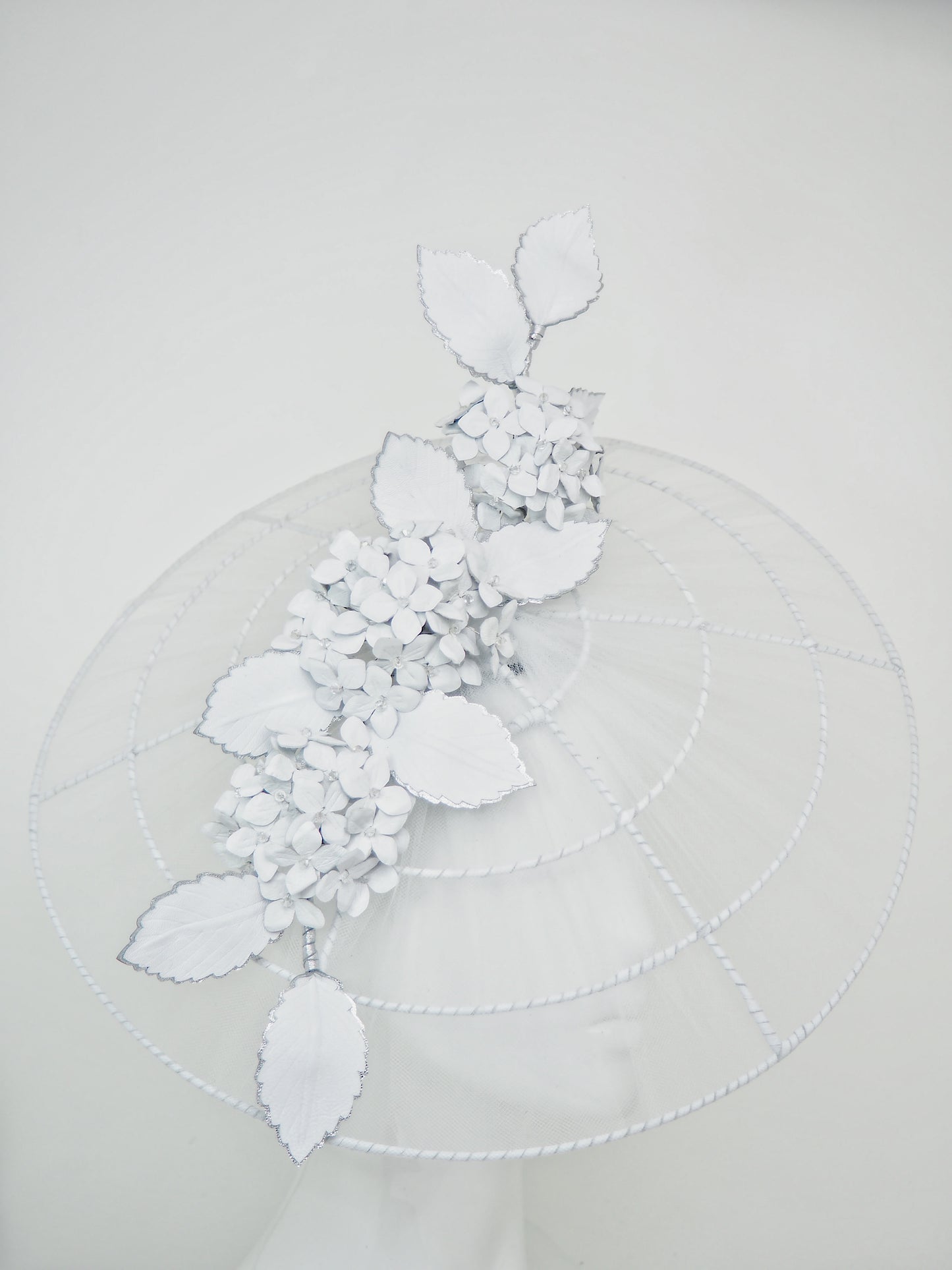 Just a Whisper - White tulle and leather brim with Hydrangeas