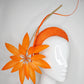 Fireworks - Orange straw base with sculpted quills and leather starburst.
