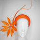 Fireworks - Orange straw base with sculpted quills and leather starburst.