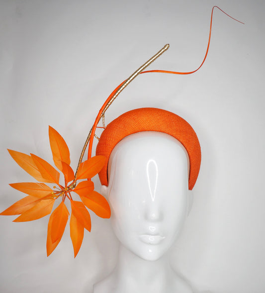 Fireworks - Orange straw base with sculpted quills and leather starburst.