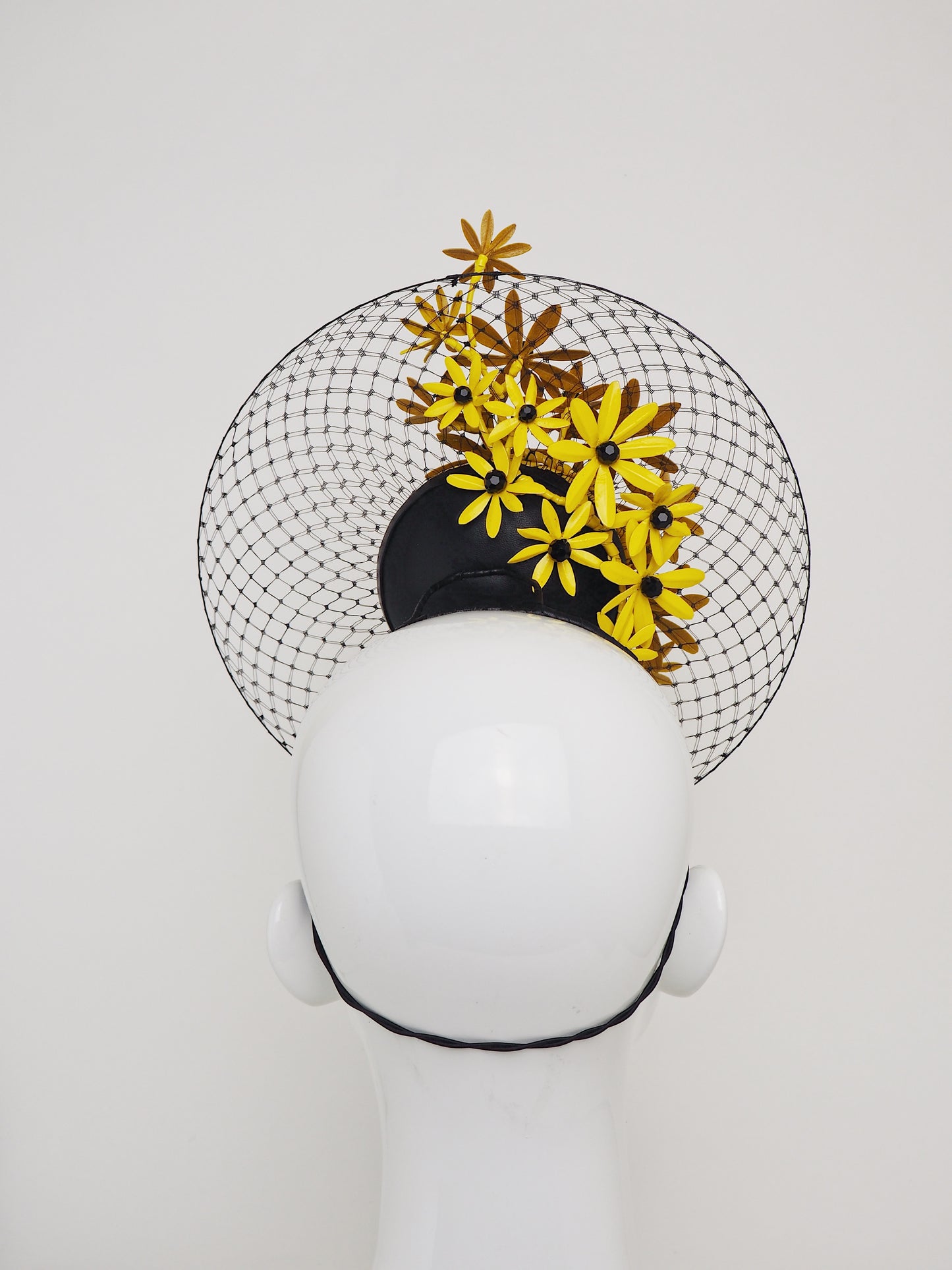 Gloriosa Daisies - Patent yellow leather percher with Gloriosa Daisies and a floating wired veil