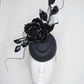 Midnight rose - pork pie pillbox with crystoform rose, metal leaves, quills and crinoline swirl.
