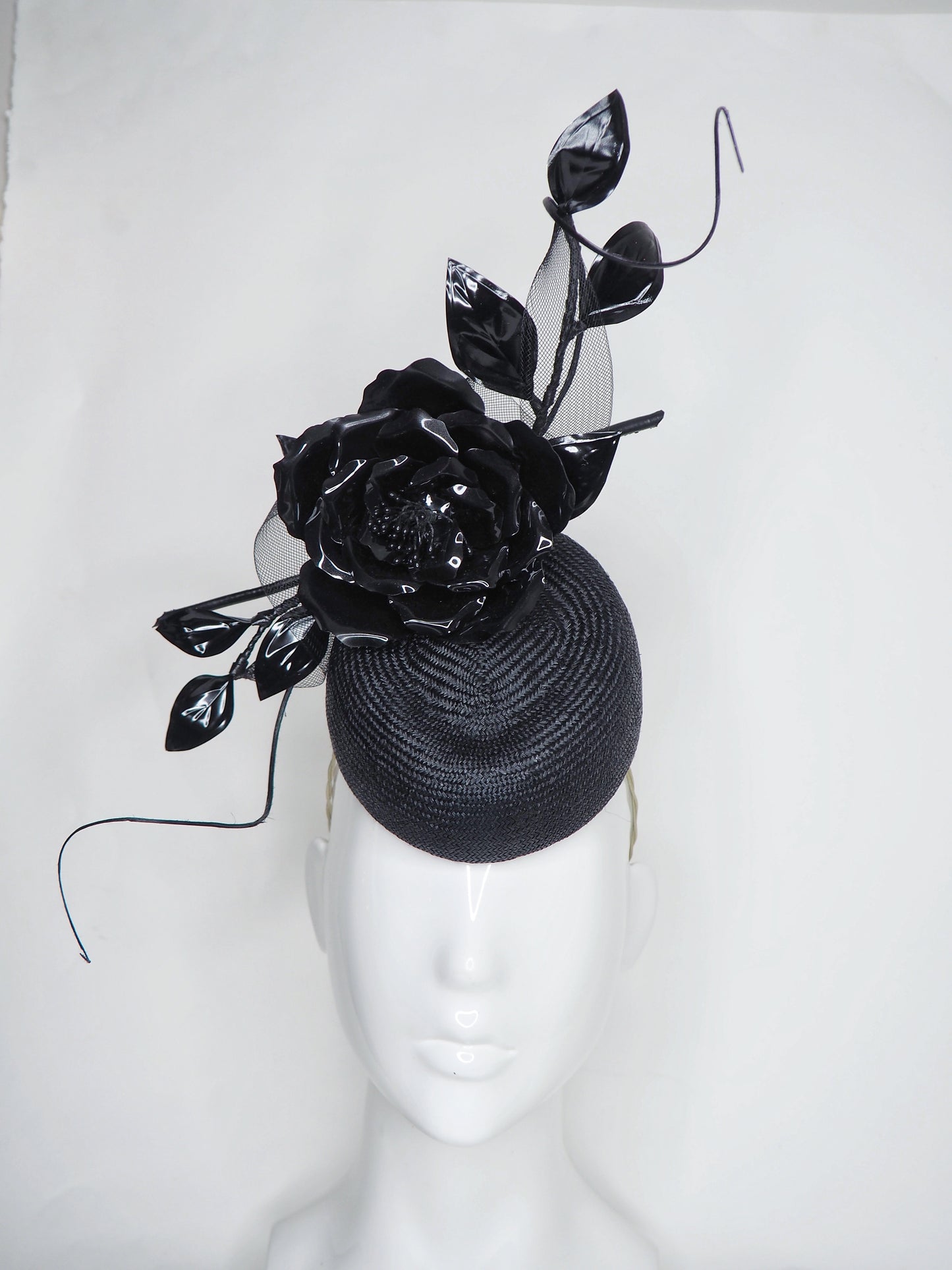 Midnight rose - pork pie pillbox with crystoform rose, metal leaves, quills and crinoline swirl.