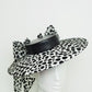 Stepping out - Medium shallow boater with black and off white bow detail