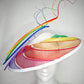 Over The Rainbow - Rainbow crinoline wired brim with textured white crown and rainbow quills.