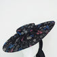Magic Dust - Tulle wire brimmed boater with petersham ties and glitter printed flowers.